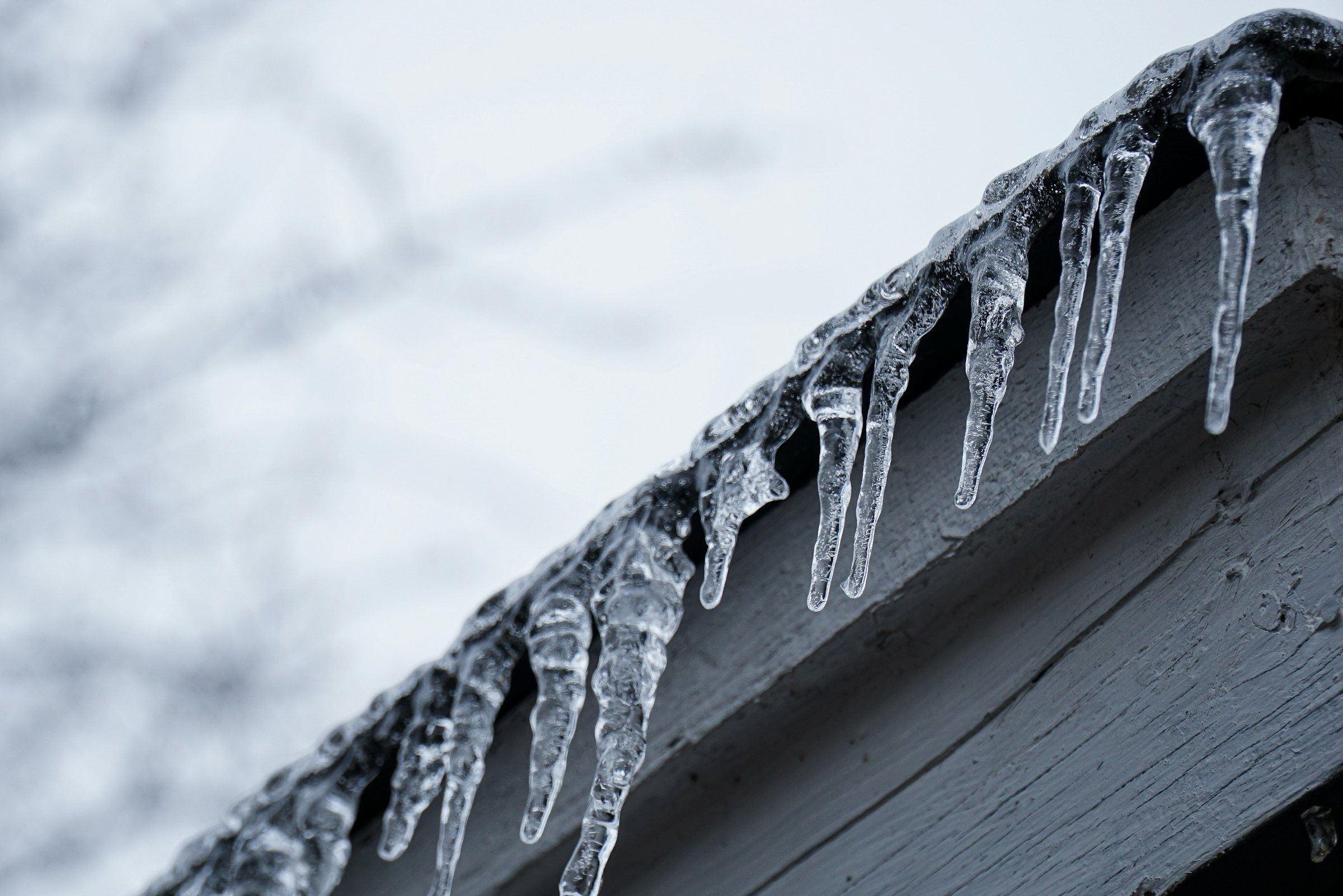 Icicles hanging from the edge of a roof